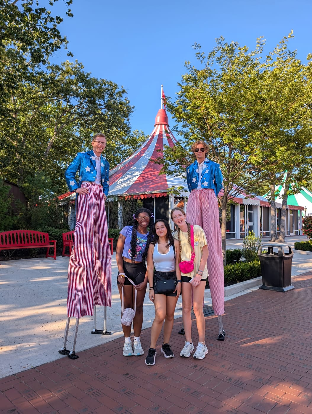 Lucy and friends with stilt walkers